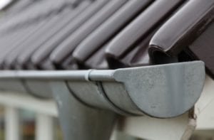 Roof gutter to roofing